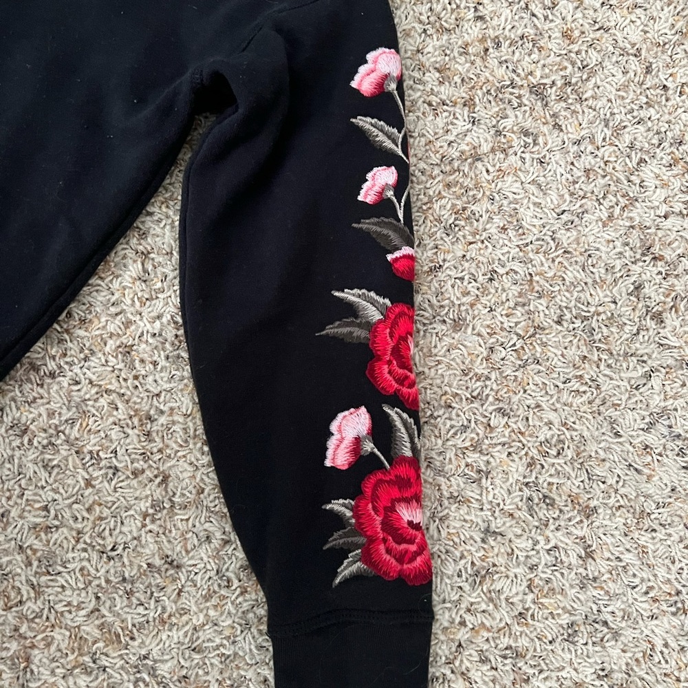 v-neck American eagle sweater with floral sleeves